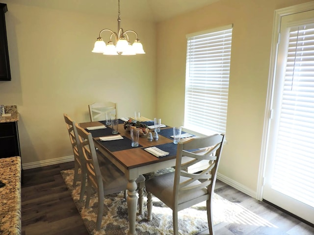 112 Westview Dr, Gun Barrel City, TX 75156 - dining space with wood finished floors, a chandelier, and vaulted ceiling