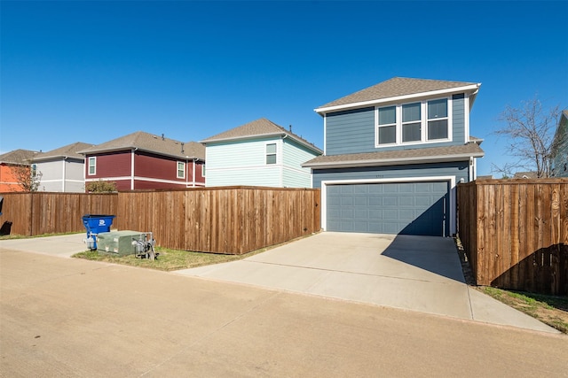3733 Patience Blvd E, Dallas, TX 75236 - view of front of property with concrete driveway, a shingled roof, fence, and an attached garage