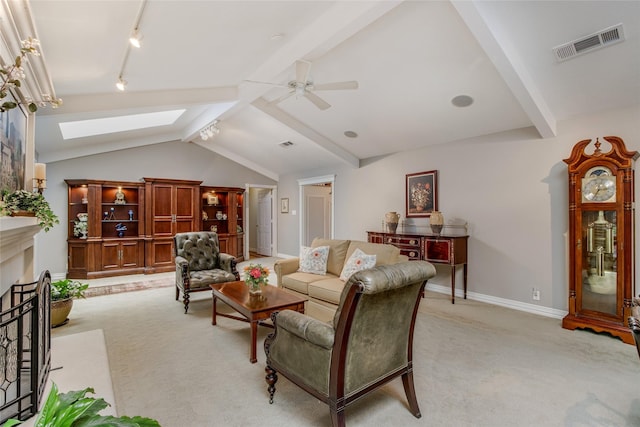 625 Estates Dr, Copper Canyon, TX 75077 - living room featuring a skylight, a ceiling fan, light colored carpet, baseboards, and rail lighting
