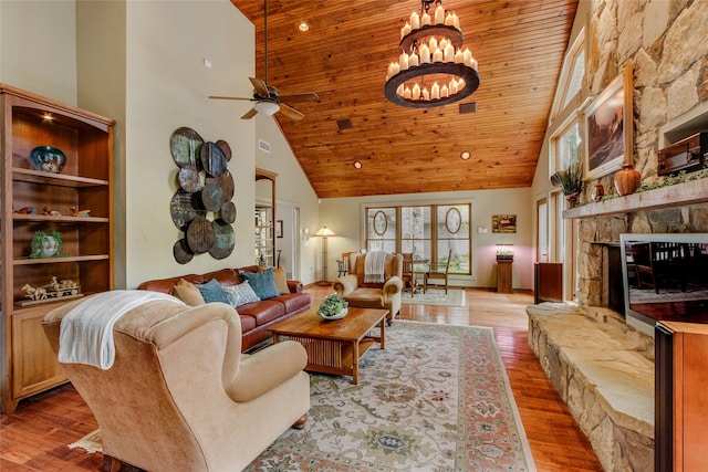 625 Estates Dr, Copper Canyon, TX 75077 - living area featuring high vaulted ceiling, wood ceiling, ceiling fan, wood finished floors, and a fireplace