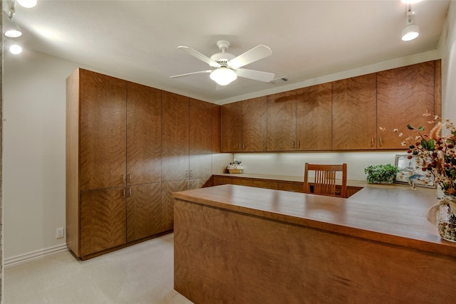 625 Estates Dr, Copper Canyon, TX 75077 - kitchen featuring brown cabinets, ceiling fan, and a peninsula