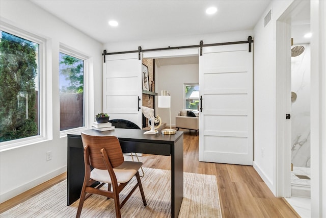 15712 Terrace Lawn Cir, Dallas, TX 75248 - office space featuring a barn door, plenty of natural light, light wood finished floors, and recessed lighting
