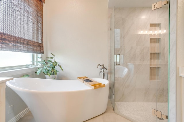 bathroom with a soaking tub and a shower stall