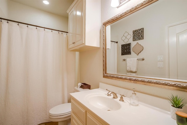 full bath with toilet, recessed lighting, and vanity