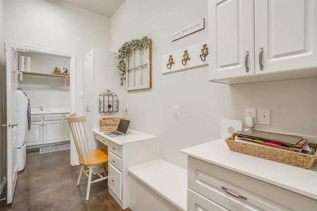 office space featuring washer and dryer and a sink
