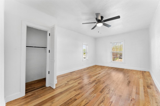 1909 Sycamore Dr, Mesquite, TX 75149 - unfurnished bedroom featuring light wood-style floors, a closet, baseboards, and ceiling fan