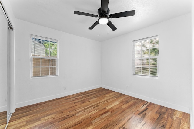 1909 Sycamore Dr, Mesquite, TX 75149 - spare room featuring light wood finished floors, baseboards, and ceiling fan
