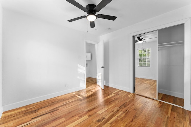 1909 Sycamore Dr, Mesquite, TX 75149 - unfurnished bedroom featuring a closet, wood finished floors, baseboards, and a ceiling fan