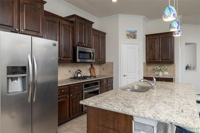 5100 Tortola Ln, Fort Worth, TX 76244 - kitchen with stainless steel appliances, a sink, dark brown cabinetry, ornamental molding, and light stone countertops