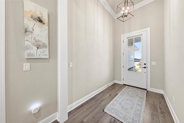 10108 Feather Trace Ln, Waco, TX 76712 - foyer featuring wood finished floors, ornamental molding, a chandelier, and baseboards