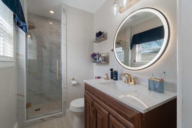 216 Belmont St, Hurst, TX 76053 - bathroom featuring toilet, a marble finish shower, vanity, and recessed lighting