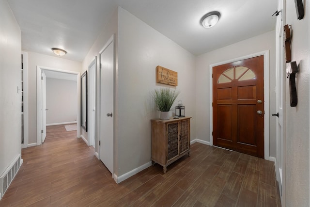 216 Belmont St, Hurst, TX 76053 - foyer featuring dark wood-style floors and baseboards