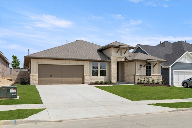2900 Barbary, Mckinney, TX 75071 - prairie-style house featuring driveway, stone siding, a shingled roof, a front lawn, and a garage