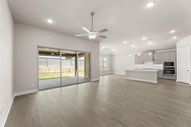 2900 Barbary, Mckinney, TX 75071 - unfurnished living room with baseboards, recessed lighting, wood finished floors, and a ceiling fan