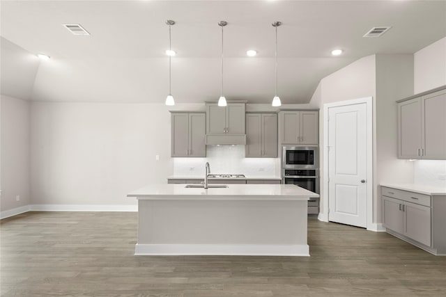 2900 Barbary, Mckinney, TX 75071 - kitchen featuring gray cabinetry, vaulted ceiling, appliances with stainless steel finishes, and a sink