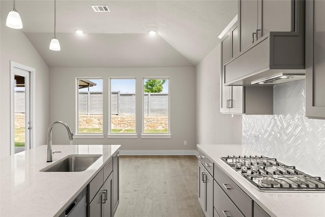 2900 Barbary, Mckinney, TX 75071 - kitchen with visible vents, stainless steel gas cooktop, lofted ceiling, and a sink