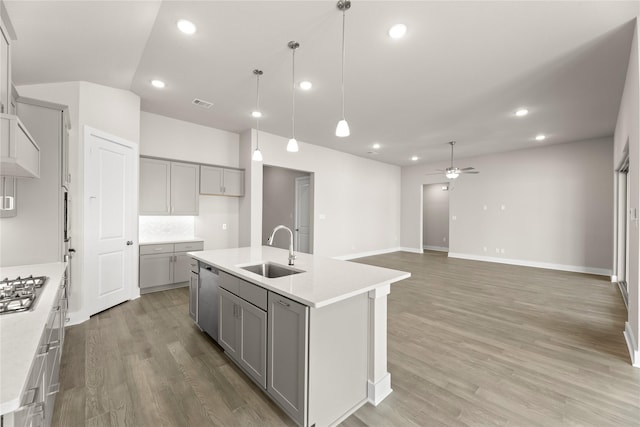 2900 Barbary, Mckinney, TX 75071 - kitchen with a ceiling fan, a sink, stainless steel appliances, and gray cabinets