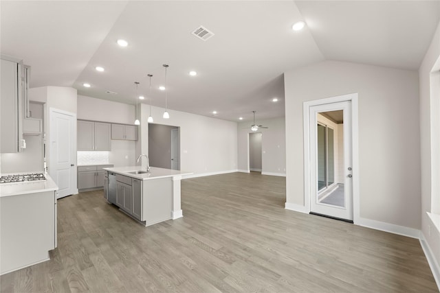 2900 Barbary, Mckinney, TX 75071 - kitchen featuring lofted ceiling, visible vents, ceiling fan, and gray cabinets