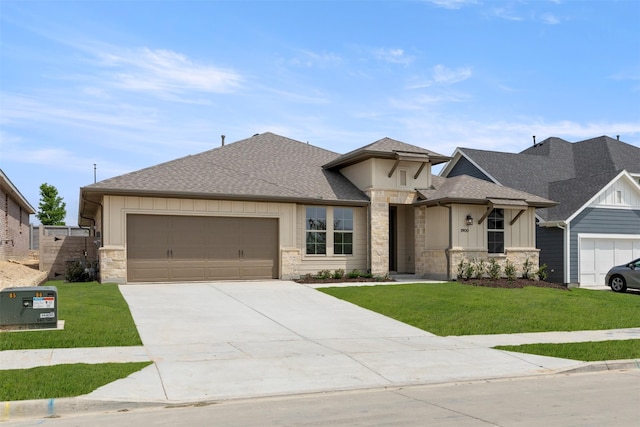 2900 Barbary, Mckinney, TX 75071 - prairie-style house with a front yard, a shingled roof, driveway, stone siding, and an attached garage