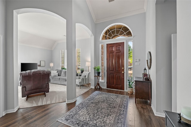953 Waterbury Way, Keller, TX 76248 - entryway with lofted ceiling, plenty of natural light, dark wood-style flooring, crown molding, and arched walkways