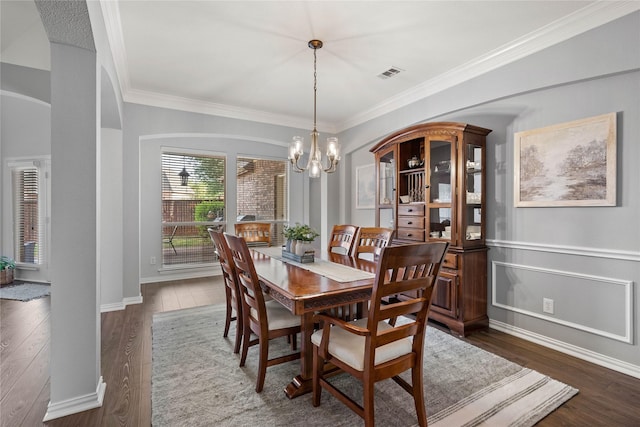 953 Waterbury Way, Keller, TX 76248 - dining area with a chandelier, crown molding, dark wood finished floors, and baseboards