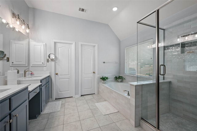 953 Waterbury Way, Keller, TX 76248 - bathroom featuring vanity, lofted ceiling, a garden tub, a stall shower, and tile patterned floors