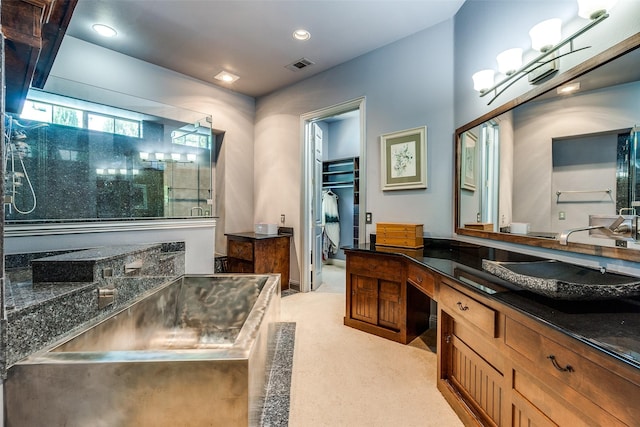 full bath featuring recessed lighting, visible vents, a shower, and vanity