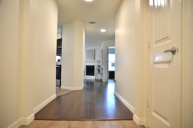9904 Southgate Dr, Mckinney, TX 75072 - hall with wood finished floors, baseboards, and recessed lighting