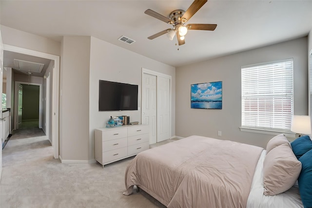 4032 Guthrie Dr, Plano, TX 75024 - bedroom featuring attic access, light carpet, a closet, and ceiling fan