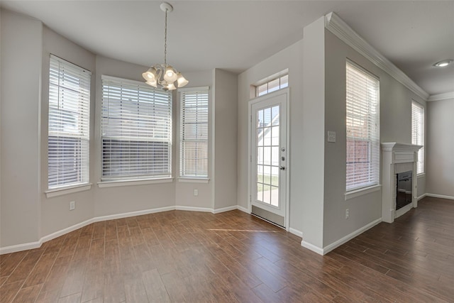 4032 Guthrie Dr, Plano, TX 75024 - interior space with baseboards, ornamental molding, an inviting chandelier, and dark wood-style flooring