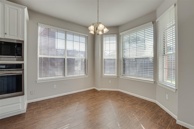 4032 Guthrie Dr, Plano, TX 75024 - unfurnished dining area featuring a chandelier, healthy amount of natural light, and dark wood-style floors