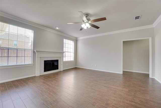 4032 Guthrie Dr, Plano, TX 75024 - unfurnished living room with a ceiling fan, ornamental molding, a glass covered fireplace, and dark wood-style flooring