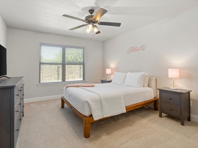 1317 Thistle Hill Trl, Weatherford, TX 76087 - bedroom with baseboards, a ceiling fan, and light carpet