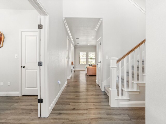 1317 Thistle Hill Trl, Weatherford, TX 76087 - entrance foyer featuring stairs, baseboards, ornamental molding, and wood finished floors