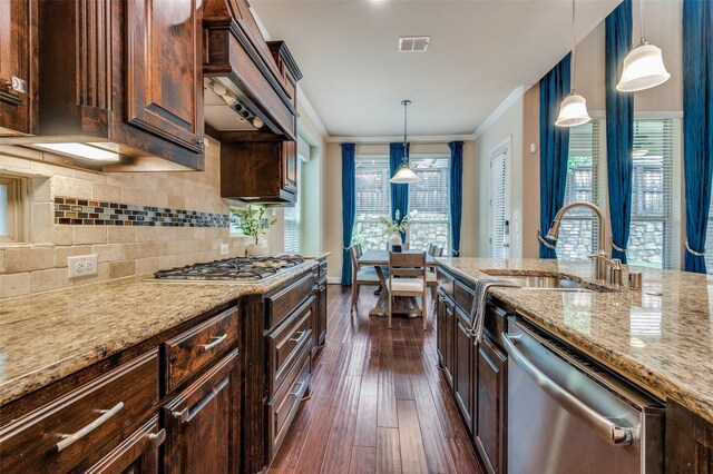 kitchen with crown molding, dark wood finished floors, a sink, light stone counters, and stainless steel appliances