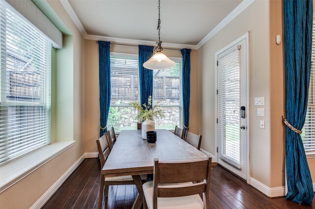 dining space with baseboards, ornamental molding, and dark wood-type flooring