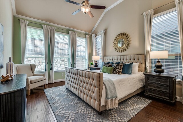 bedroom with crown molding, lofted ceiling, baseboards, a ceiling fan, and dark wood finished floors