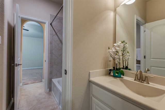 full bathroom featuring vanity, tile patterned flooring, and bathtub / shower combination