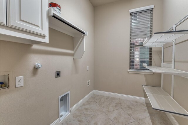 clothes washing area with light tile patterned floors, hookup for a gas dryer, electric dryer hookup, and hookup for a washing machine