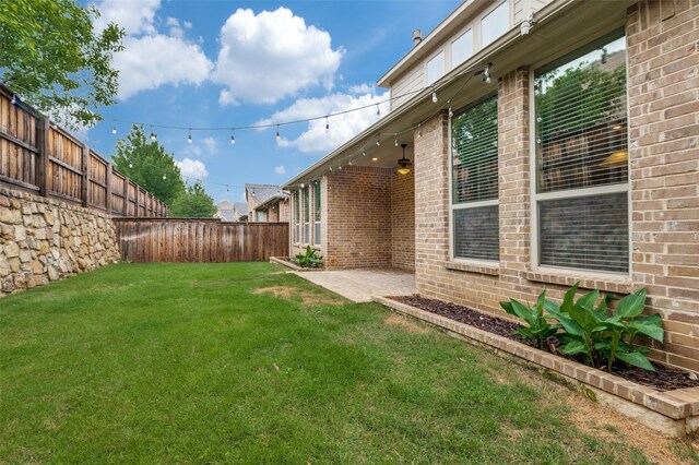 view of yard with a fenced backyard and a patio