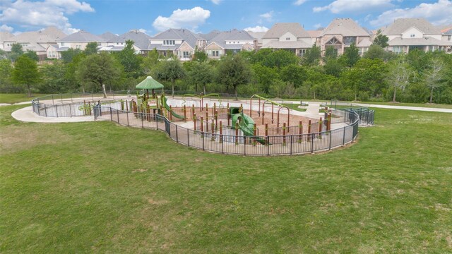 surrounding community featuring a lawn, fence, a residential view, and playground community
