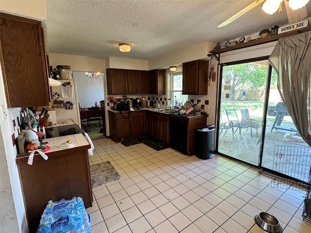 2205 Meadow Ln, Garland, TX 75040 - view of patio / terrace with outdoor dining area, a fenced backyard, and a fire pit