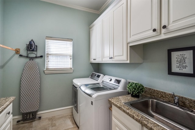 2890 Creekwood Ln, Prosper, TX 75078 - laundry area with washing machine and dryer, cabinet space, crown molding, and light marble finish flooring