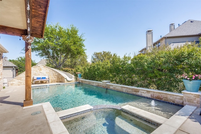 2890 Creekwood Ln, Prosper, TX 75078 - view of pool featuring a water slide and a pool with connected hot tub