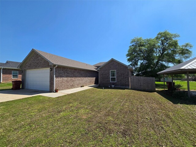109 Baker St, Mount Vernon, TX 75457 - view of home's exterior with a garage, brick siding, a gazebo, and driveway