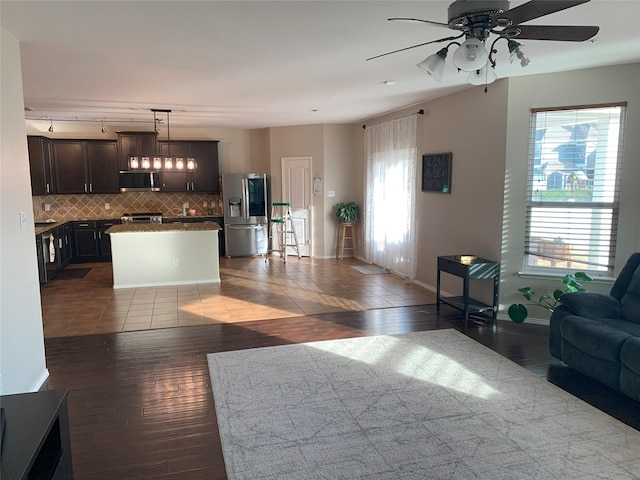 9140 Blackstone Dr, Providence Village, TX 76227 - living area with dark wood finished floors, baseboards, and a ceiling fan