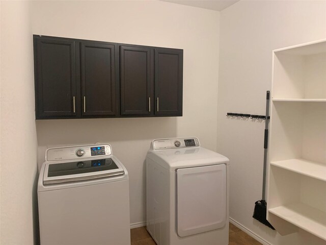 9140 Blackstone Dr, Providence Village, TX 76227 - clothes washing area with washer and dryer, baseboards, and cabinet space