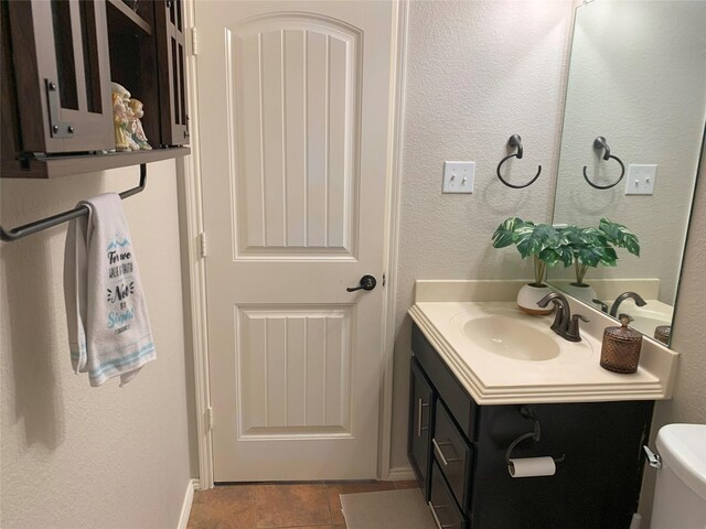 9140 Blackstone Dr, Providence Village, TX 76227 - bathroom featuring toilet, vanity, and a textured wall