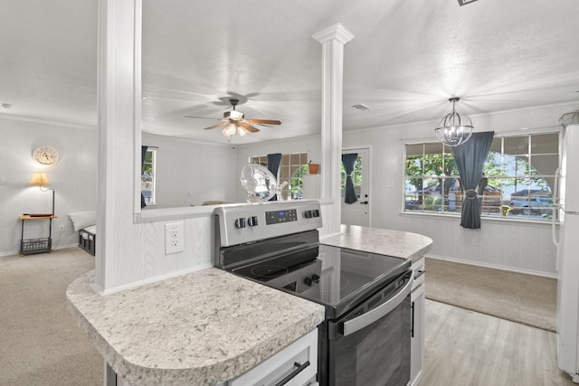 281 Harbor Dr, Gun Barrel City, TX 75156 - kitchen with stainless steel electric range oven, plenty of natural light, light countertops, baseboards, and ornamental molding
