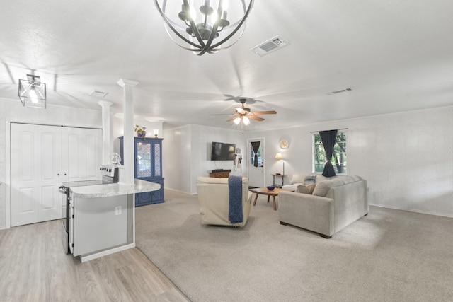 281 Harbor Dr, Gun Barrel City, TX 75156 - living area featuring baseboards, decorative columns, a chandelier, light wood-style flooring, and a ceiling fan